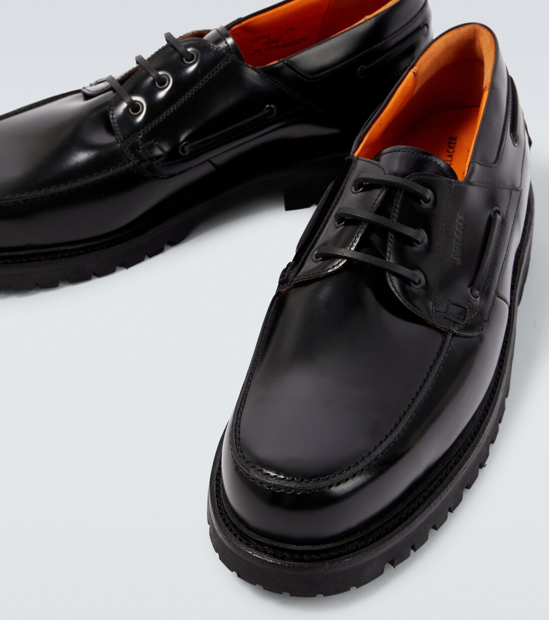 x Heinrich Dinkelacker leather boat shoes in black - Junya