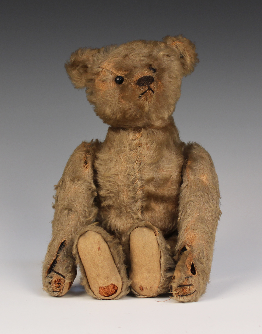 An early Steiff mohair clockwork teddy bear with button in left