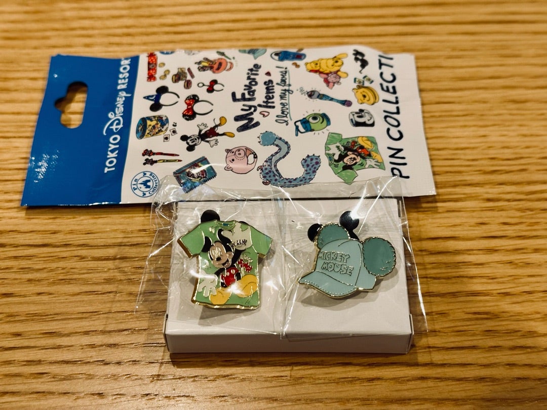 TDR: パークのお土産モチーフのミステリーピンバッジ！何が入っている