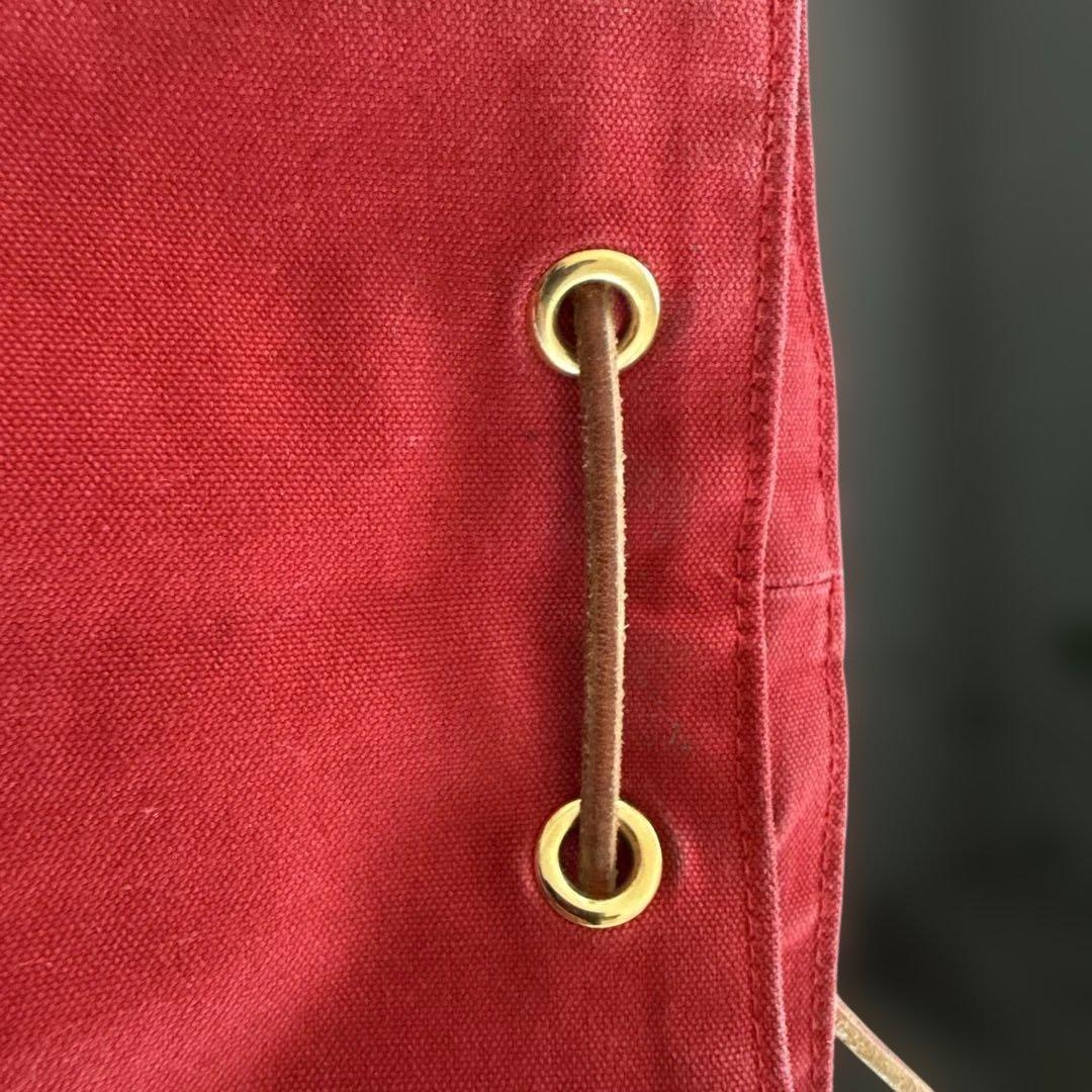 エルメス赤いキャンバスドローストリングショルダーバック
