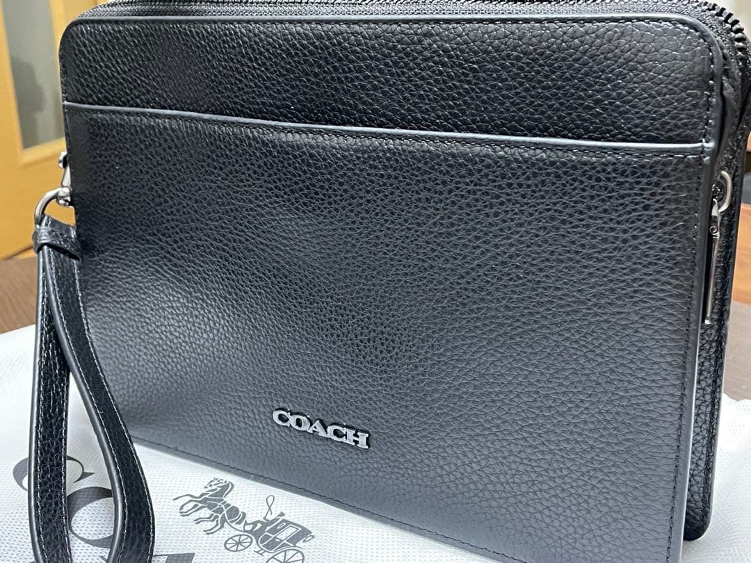 COACH ブラック レザー クラッチバッグ - メルカリ
