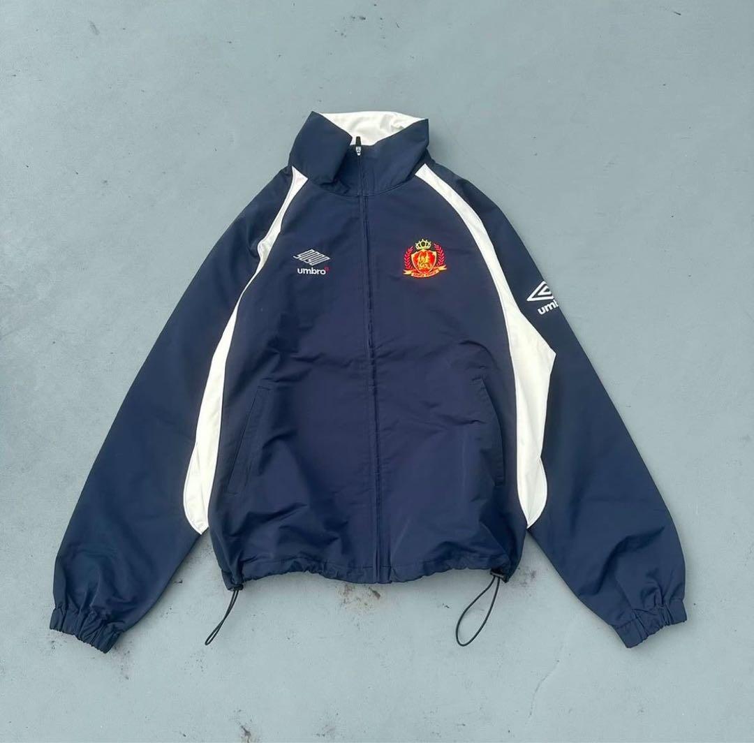 9090 umbro emblem nylon jacket - メルカリ