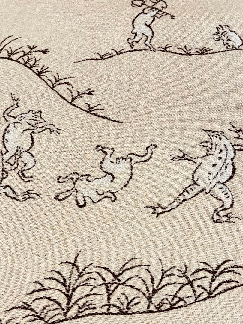 素敵な装い！西陣名古屋帯 綿芯仕立付 「鳥獣人物戯画」クリーム