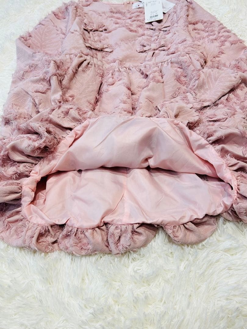 新品タグ付】merry jenny リボンフリンジジャガードチュニック ピンク