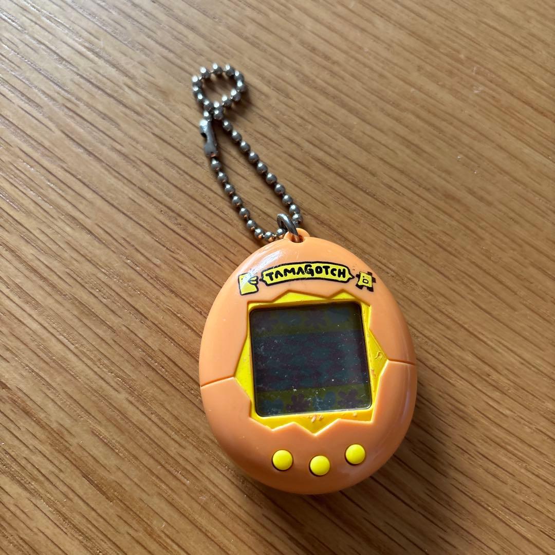 ジャンク扱い・動作未確認たまごっち 初代 オレンジ色 - メルカリ