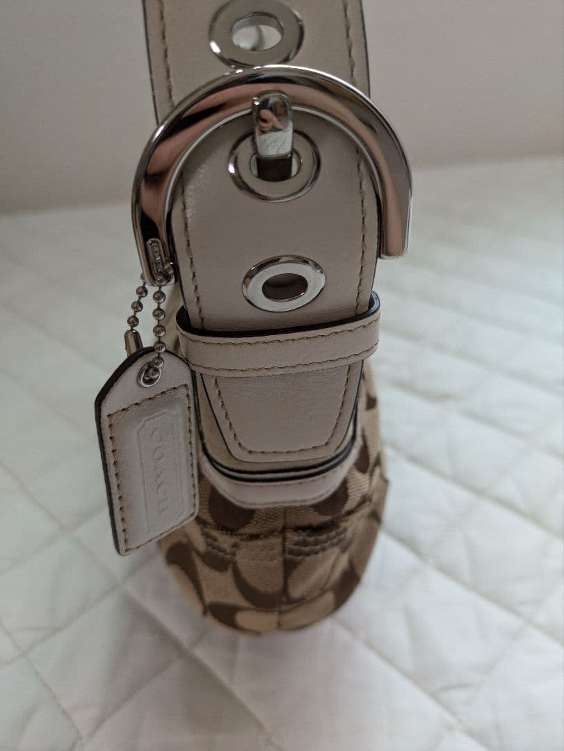 コーチcoach茶色シグネチャー模様キャンバス 半円形スモールホーボー