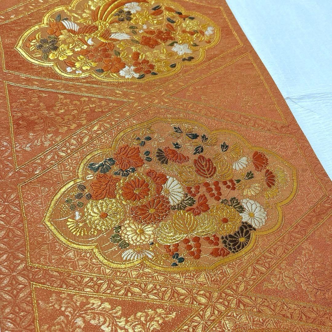 梅垣織物 袋帯 西陣織 七宝菱蒔絵文 正絹 金糸 オレンジゴールド系