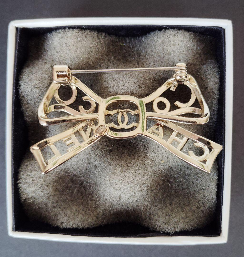 くるみぱん様検討中 CHANEL リボン型ブローチ シルバー