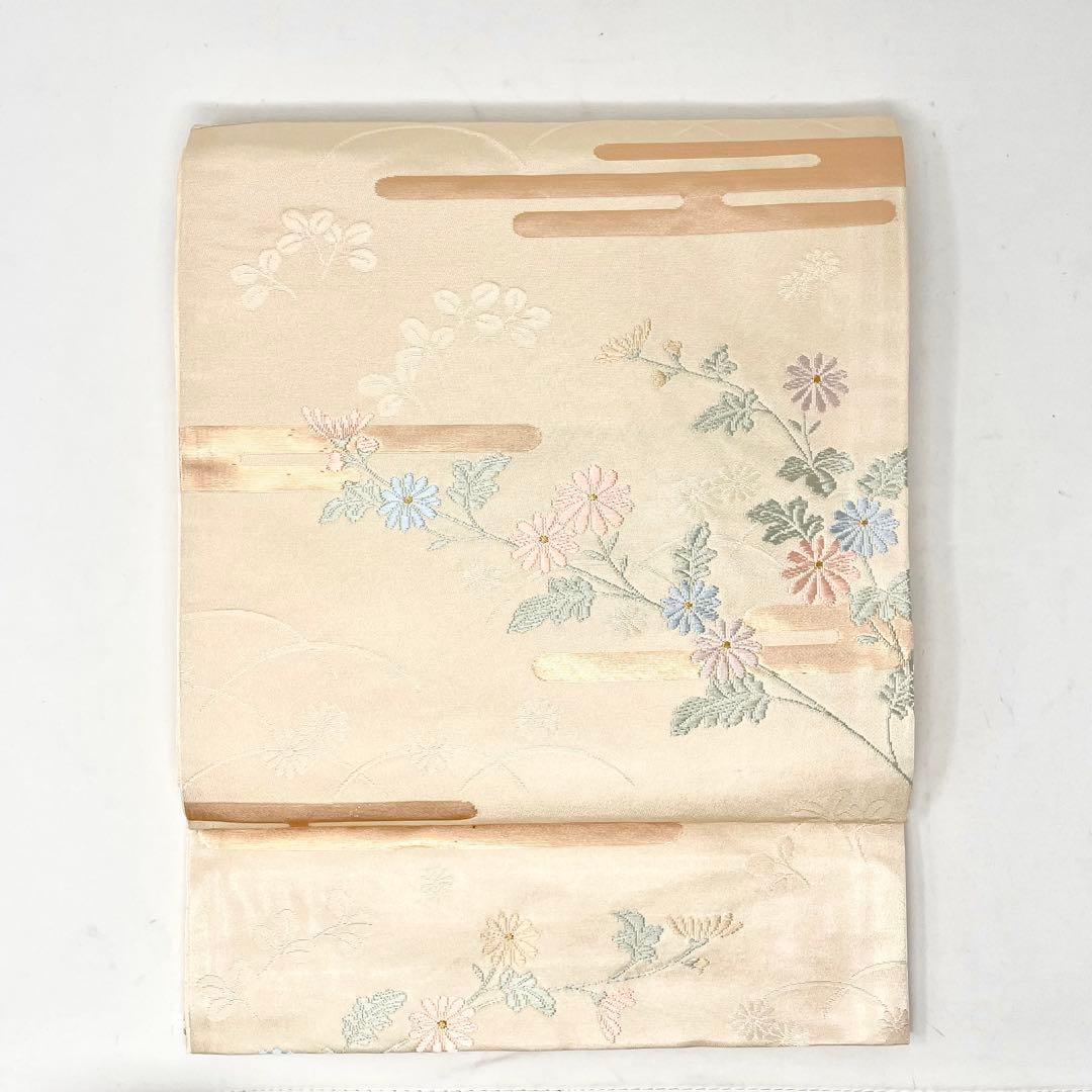 未使用［ 名古屋帯/ポリエステル ］東レシルック 生成り 菊 霞 芝草