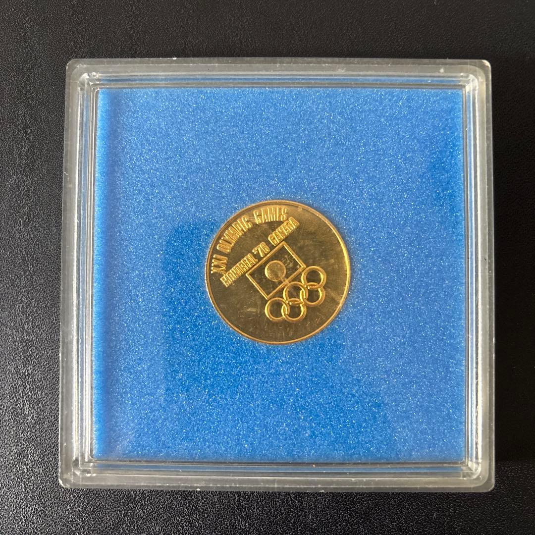 1976年モントリオールオリンピック金メッキ記念硬貨 - メルカリ